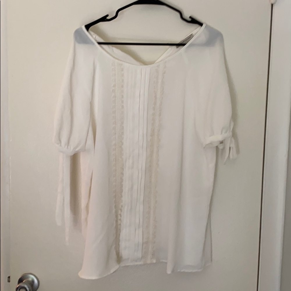 White ruffle blouse